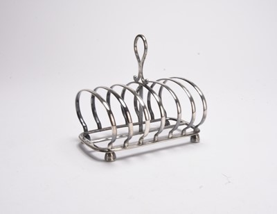Lot 95 - A Victorian silver six division toast rack