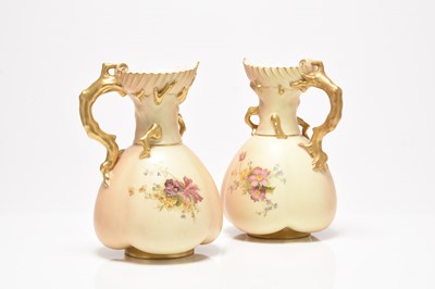 Lot 151 - A pair of Royal Worcester quatrelobe coral jugs, dated 1908 and 1909