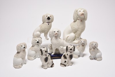 Lot 110 - A collection of Staffordshire spaniels and poodles, mid-19th century