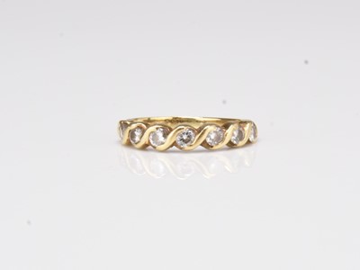 Lot 213 - A yellow gold seven stone diamond ring