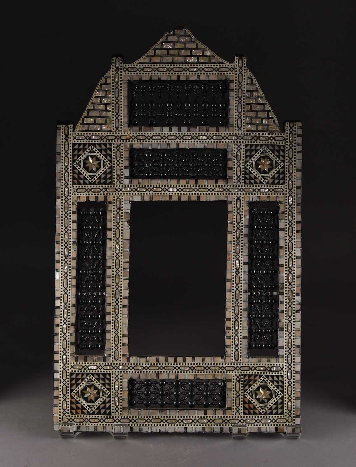 Lot 68 - An Egyptian Mashrabiya inlaid mirror frame