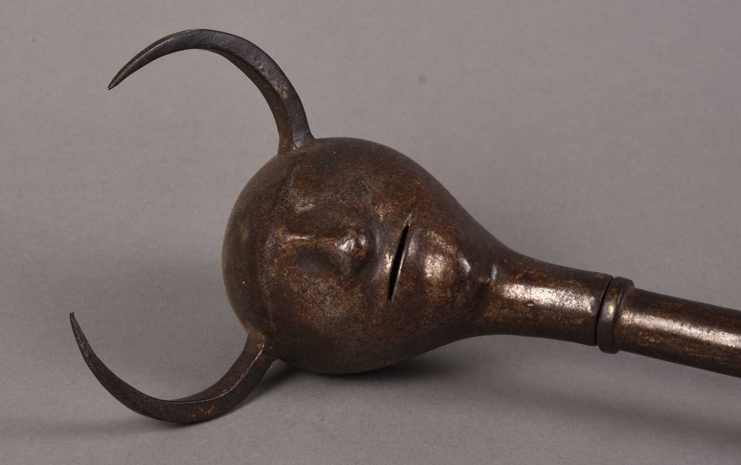 Lot 62 - A Persian Devil's head mace, Qajar Dynasty,