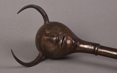 Lot 62 - A Persian Devil's head mace, Qajar Dynasty, 19th century