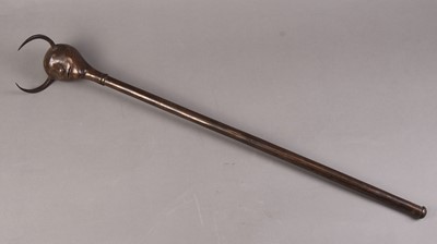 Lot 62 - A Persian Devil's head mace, Qajar Dynasty, 19th century