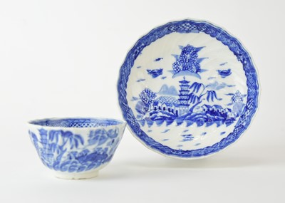 Lot 27 - An uncommon Caughley spiral reeded and shanked 'Tower' tea bowl with saucer, circa 1790-96