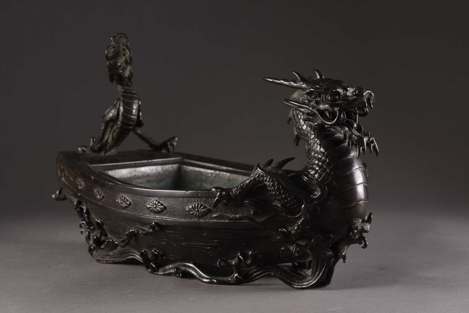 Lot 205 - A Japanese bronze planter in the form of a dragon ship, Meiji era