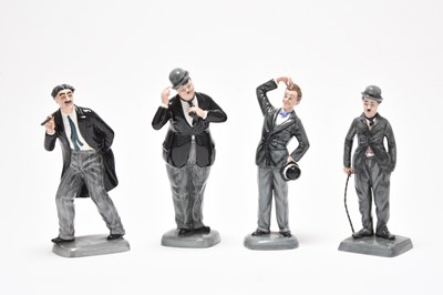 Lot 177 - Four Royal Doulton figures - Oliver Hardy, Groucho Mark, Stan Laurel, Charlie Chaplin