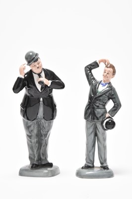 Lot 177 - Four Royal Doulton figures - Oliver Hardy, Groucho Mark, Stan Laurel, Charlie Chaplin