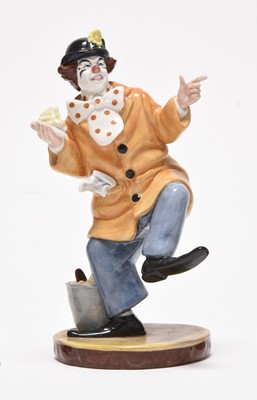Lot 162 - Three Royal Doulton figures including 'Mask Seller' HN2103 and a group of monk figures