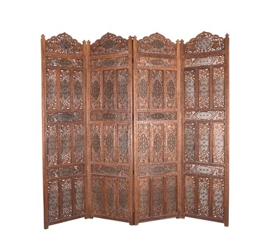 Lot 221 - An Indian carved hardwood four-fold screen