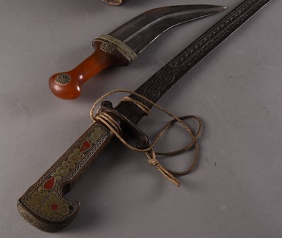 Lot 224 - An Algerian decorative sword and a near Eastern Jambiya dagger
