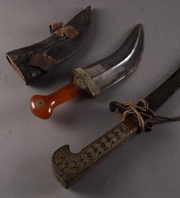 Lot 224 - An Algerian decorative sword and a near Eastern Jambiya dagger