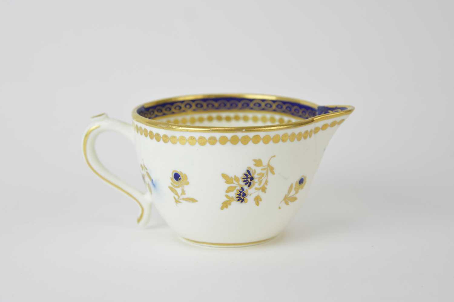 Lot 41 - A Caughley 'Dresden Flowers' milk jug, circa 1788-93