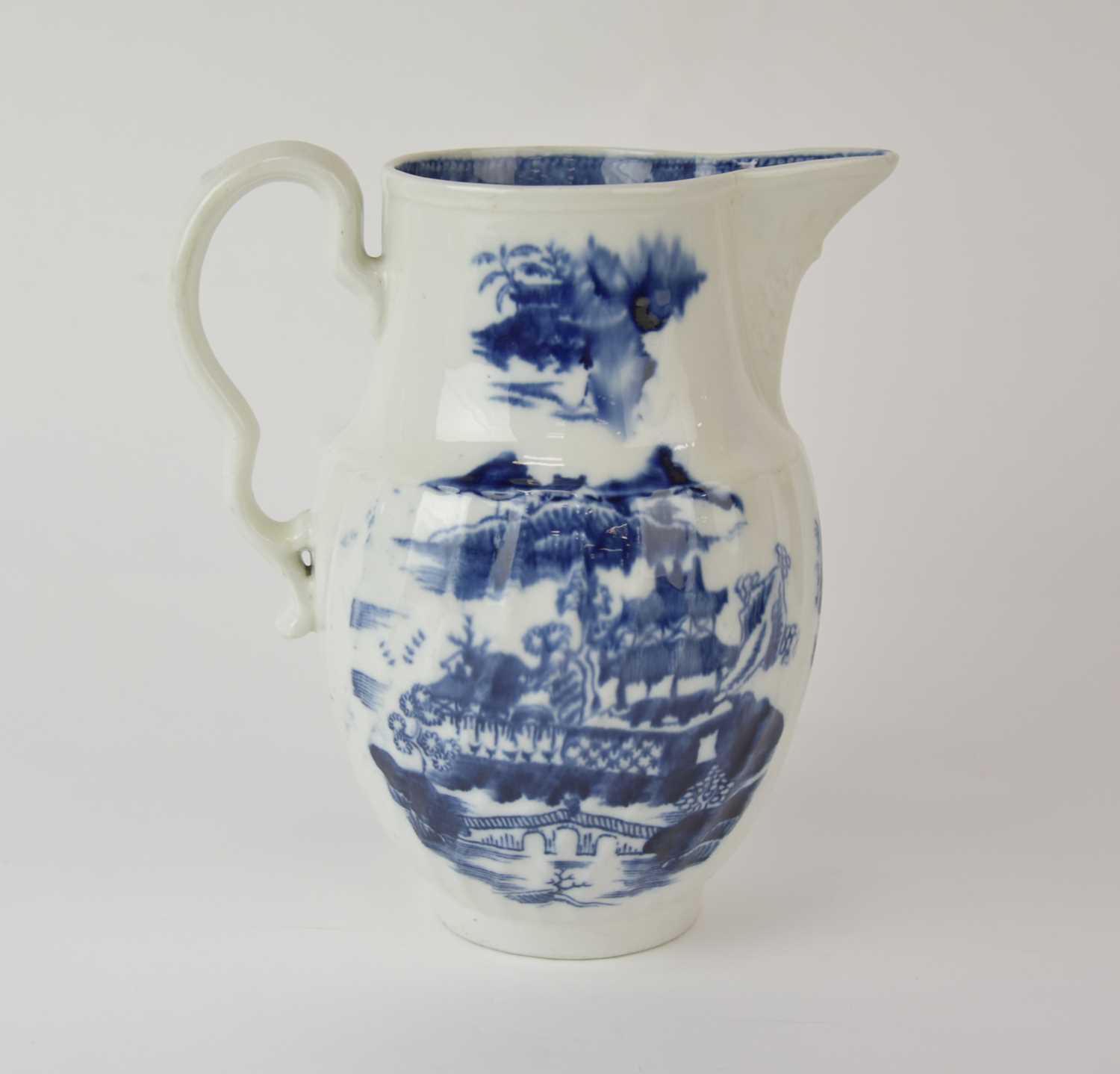 Lot 43 - A rare John Rose Coalport 'Latticed Fence and Pagoda' jug, circa 1796-1800