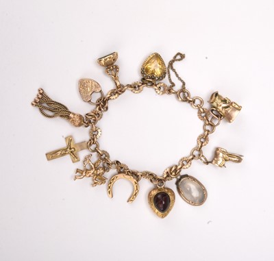 Lot 326 - A 9ct gold charm bracelet with attached charms