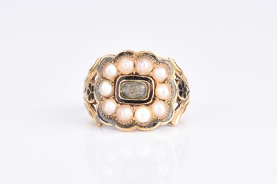 Lot 335 - A mid 19th century 18ct gold black enamel and seed pearl mourning ring