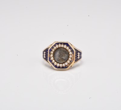 Lot 315 - A 19th century blue and white enamel seed pearl mourning ring