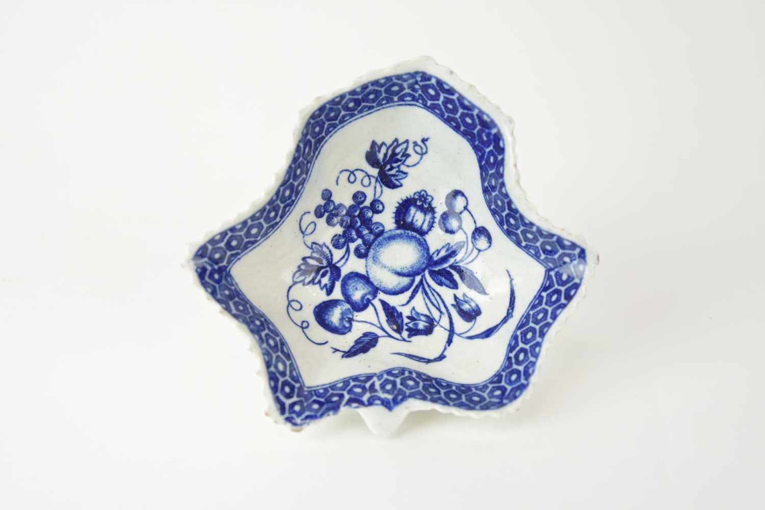 Lot 14 - An uncommon Worcester 'Pickle Leaf Fruit' pickle dish, circa 1780-85