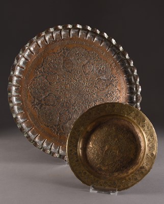Lot 58 - A Persian tinned copper tray and an embossed dish, late 19th century