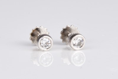 Lot 328 - A pair of brilliant cut diamond stud earrings