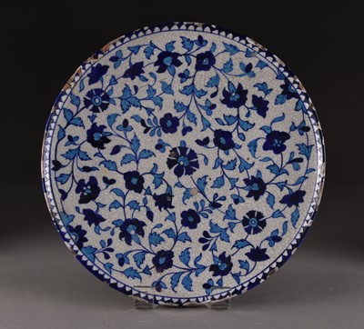 Lot 6 - A Multan tin glazed earthenware circular dish, 19th century