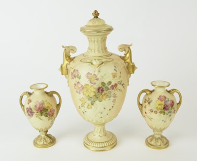 Lot 158 - Three Royal Worcester blush ivory vases, one with cover