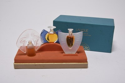 Lot 275 - A set of Lalique Les Introuvables miniature perfume bottles in original box with contents, 1998-2000