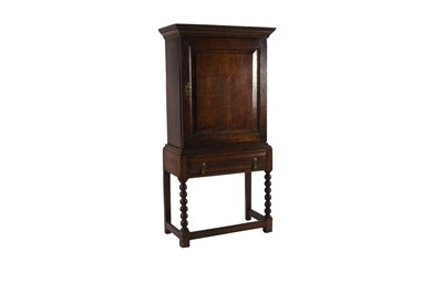 Lot 76 - An 18th century oak cupboard on associated stand