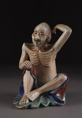 Lot 136 - A Chinese famille rose figure of an ascetic lohan, Republic period