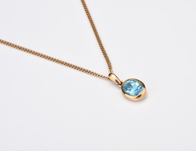 Lot 316 - A 9ct gold single stone topaz pendant on chain