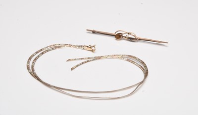 Lot 252 - A 9ct gold chain and a bar brooch