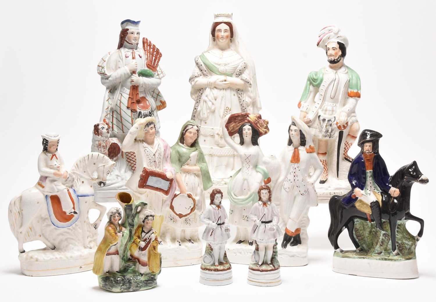 Lot 119 - Staffordshire figures including Dick Turpin, Queen Victoria and St. George