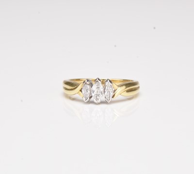 Lot 104 - An 18ct gold graduated three stone marquise cut diamond ring