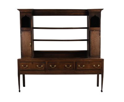 Lot 82 - An 18th century oak dresser and rack