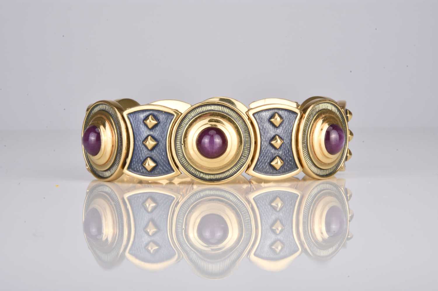 Lot 231 - An 18ct gold star ruby and enamel bracelet by Leo De Vroomen