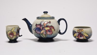 Lot 188 - Moorcroft 'Orchid' three-piece tea service, mid-20th century