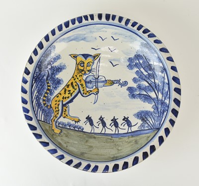 Lot A good quality potter's reproduction of an 18th century delft 'Cat and the Fiddle' charger