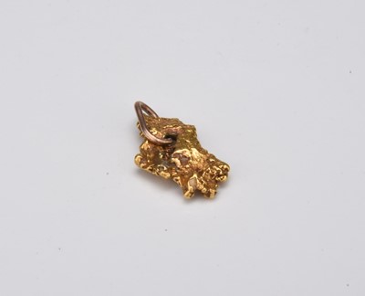 Lot 357 - A yellow metal ingot with pendant bail