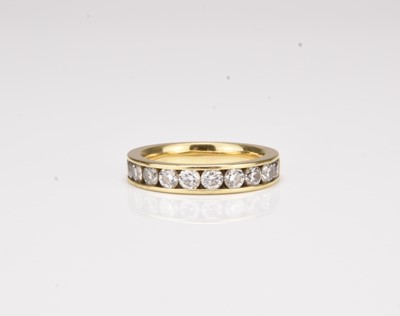 Lot 263 - An 18ct gold eleven stone diamond set half eternity ring