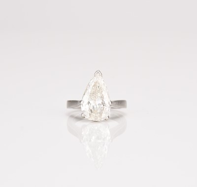 Lot A platinum single stone pear cut diamond ring
