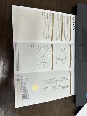 Lot 140 - A platinum single stone cushion cut diamond ring