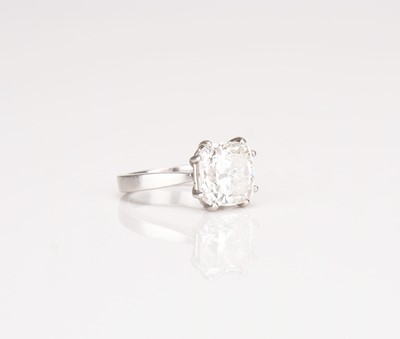 Lot A platinum single stone cushion cut diamond ring