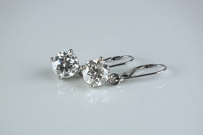 Lot 202 - A pair of brilliant cut diamond earrings