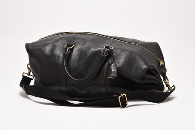 Lot 378 - A Mulberry Clipper travel bag in black leather with brass hardware