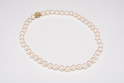 Lot 274 - A single strand uniform cultured pearl necklace with diamond set clasp