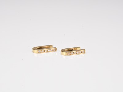 Lot 266 - A pair of 18ct gold diamond earrings
