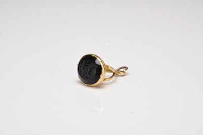 Lot 340 - A yellow metal mounted carved intaglio seal