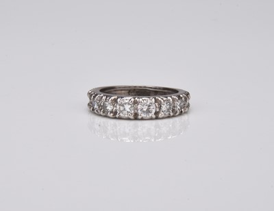 Lot A graduated diamond set half eternity ring