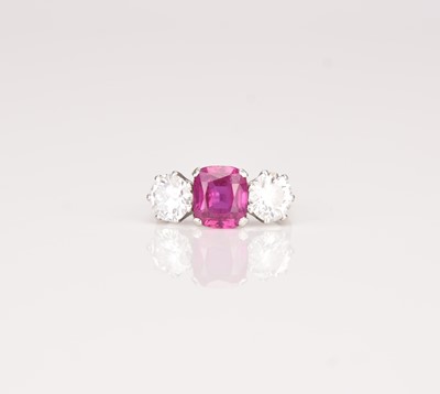 Lot A three stone ruby and diamond ring