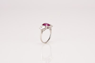 Lot 161 - A three stone ruby and diamond ring